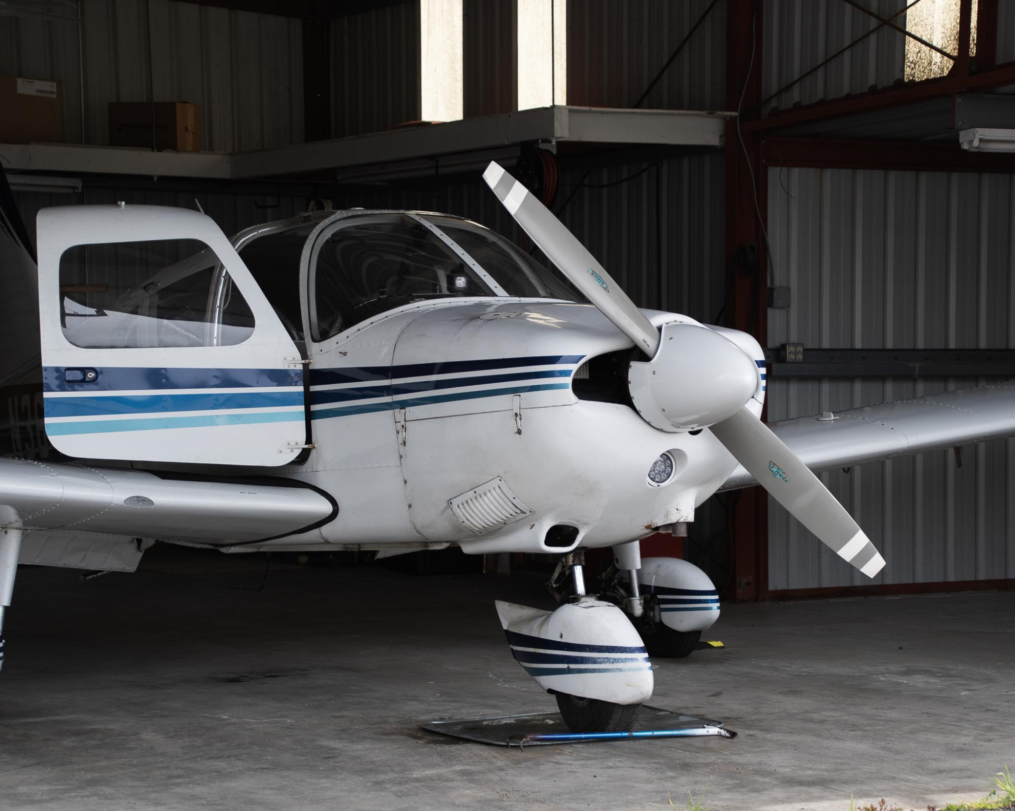 A Piper Cherokee, a common aircraft among student pilots, sits in its hanger at Gnoss Field in Novato.
