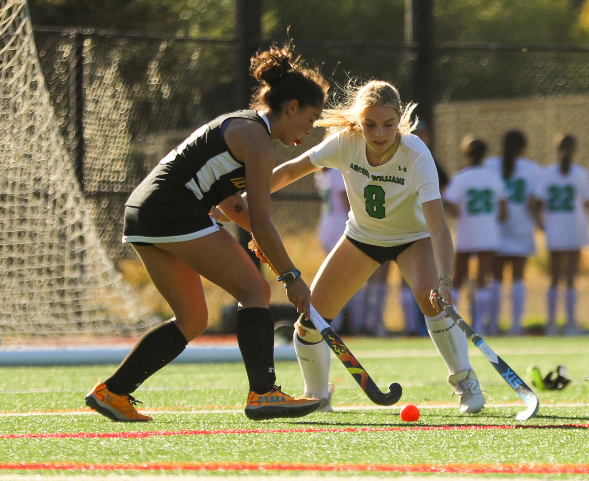 Sophomore number eight Sophie Macdonald goes to defend the opponent. 