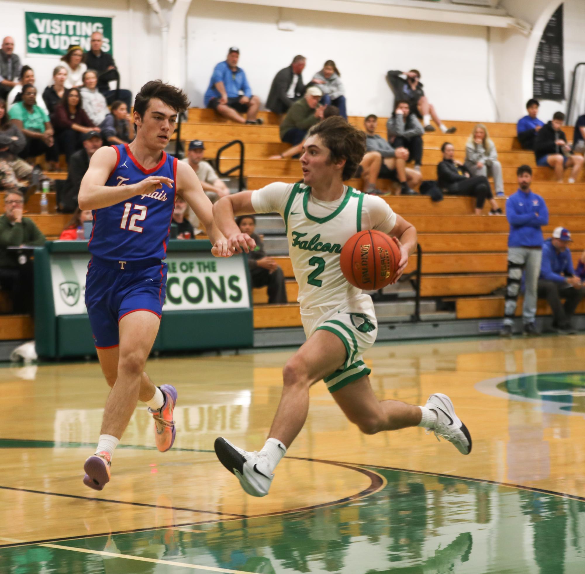 Junior Grady Stewart pushes past the defender and drives to the basket. 