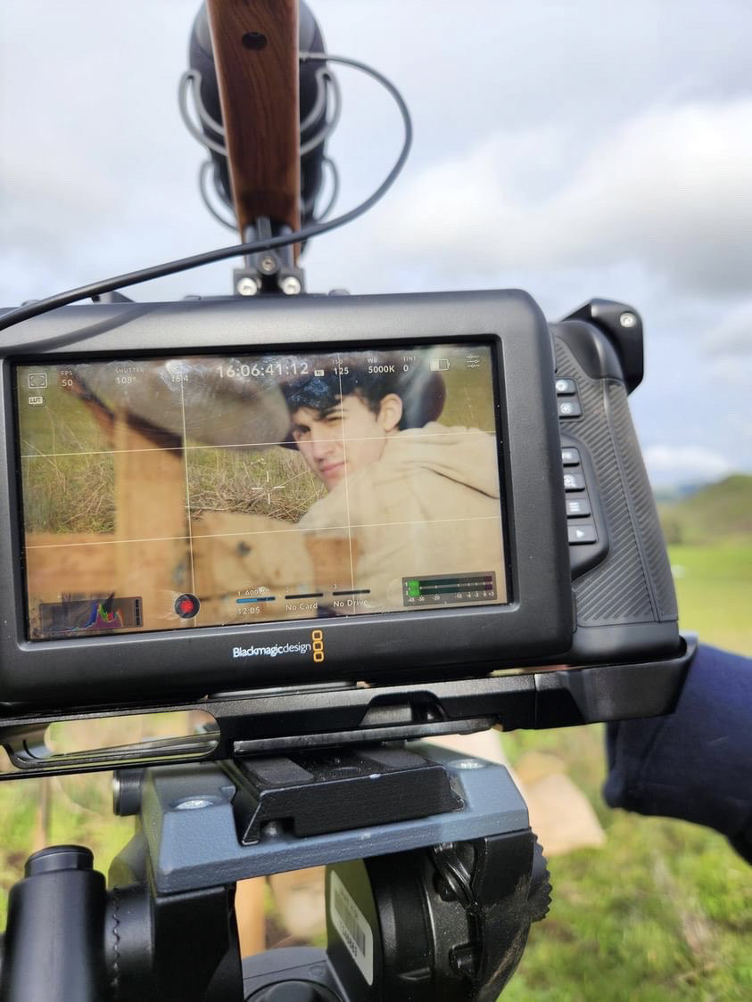 Senior Roy Quass is seen through the monitor of one of ComCad's cameras.