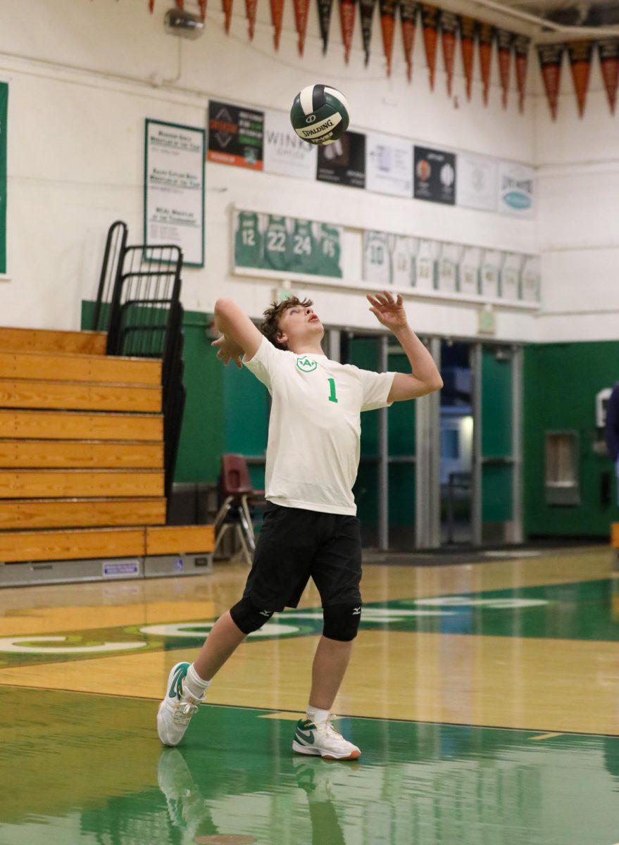 Archie Williams freshman Nash Freeman serves up the ball.