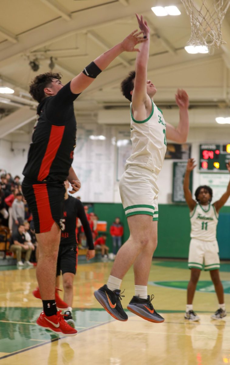 Junior Brian Wright, who was moved up to varsity halfway through his freshman season, jumps up for a shot in the third quarter of a game against San Rafael. 