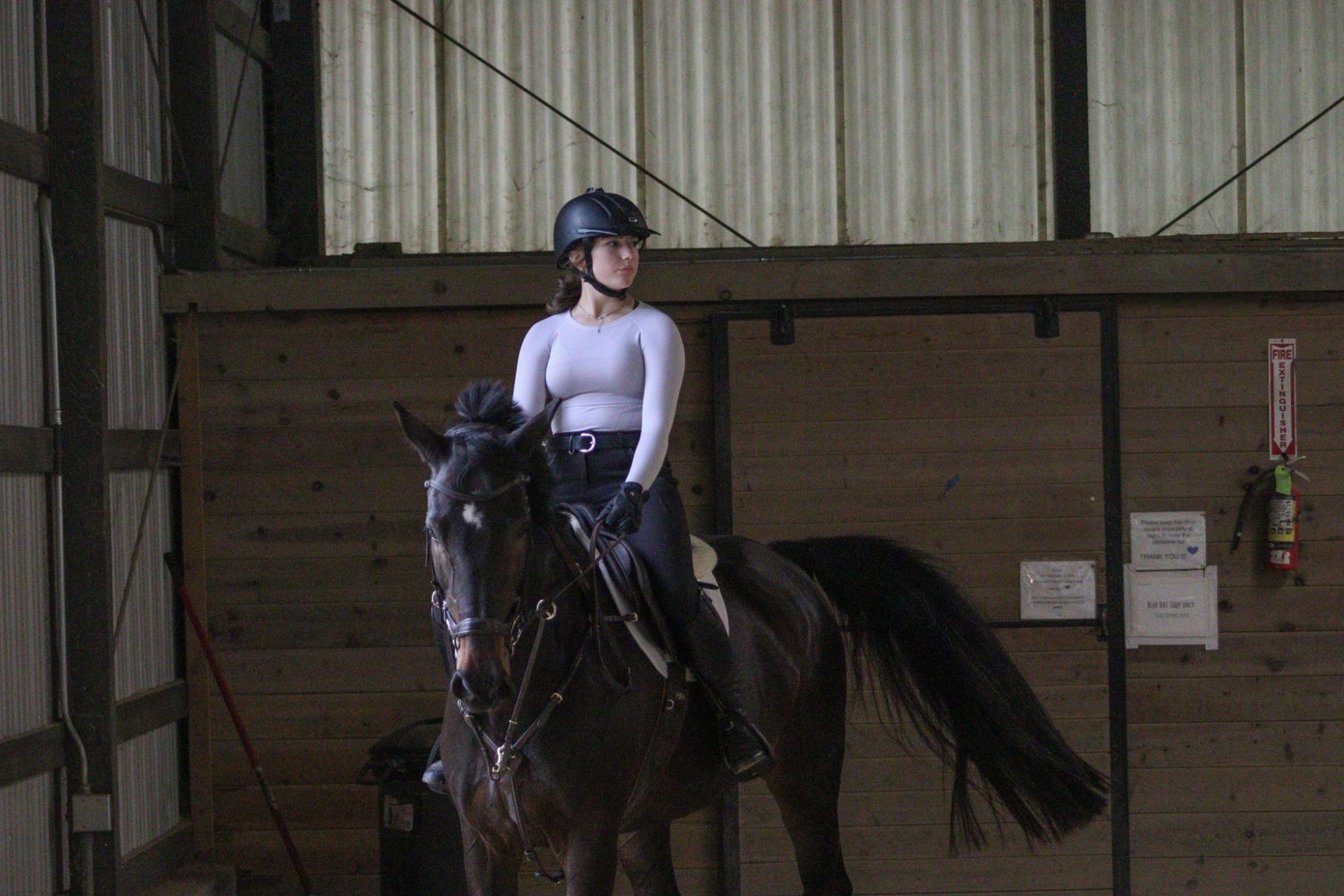 Mareena Cosgrove works with her horse Cali during a training session.