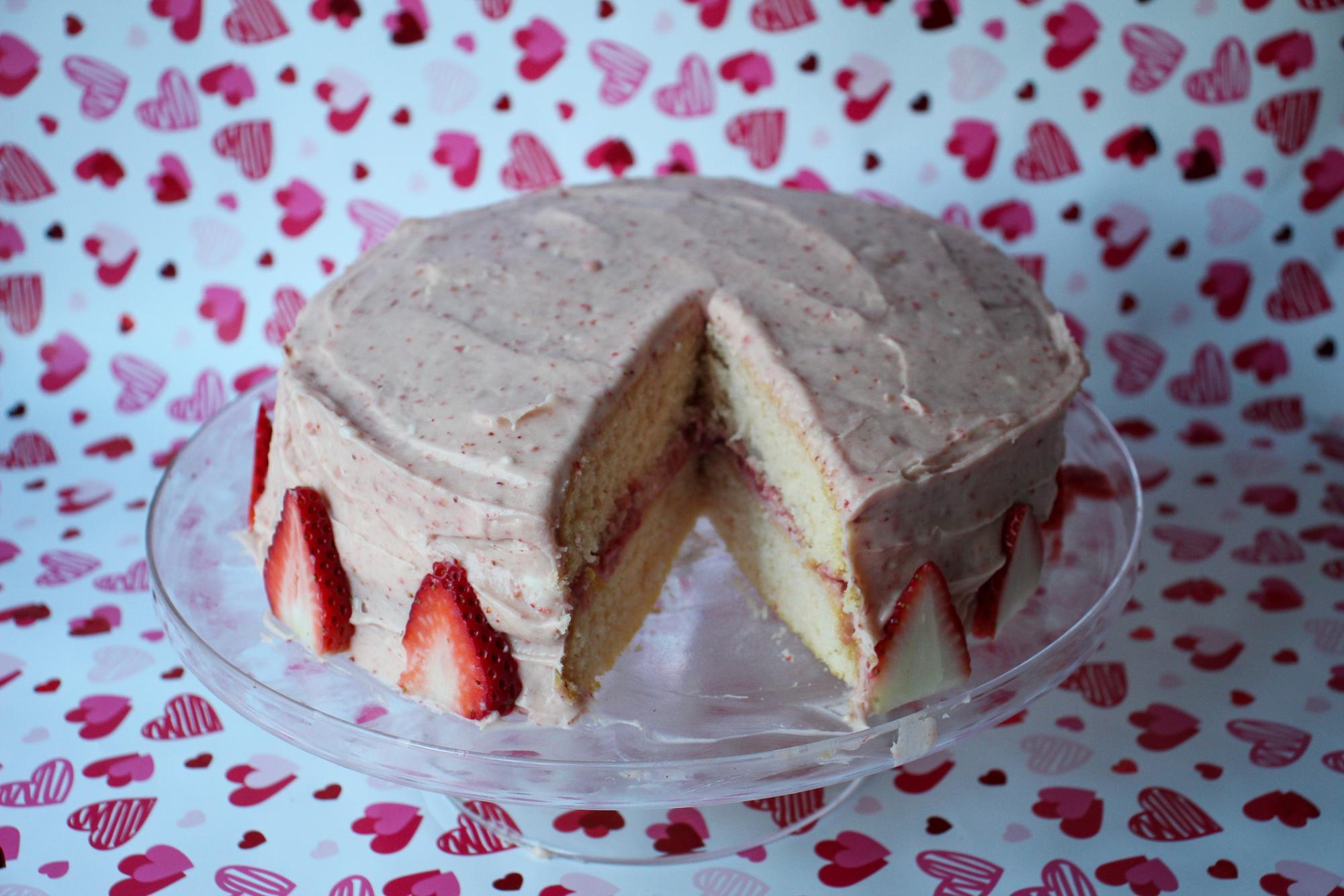 Homemade strawberry cake sliced and ready to eat for a special Valentines Day treat. 