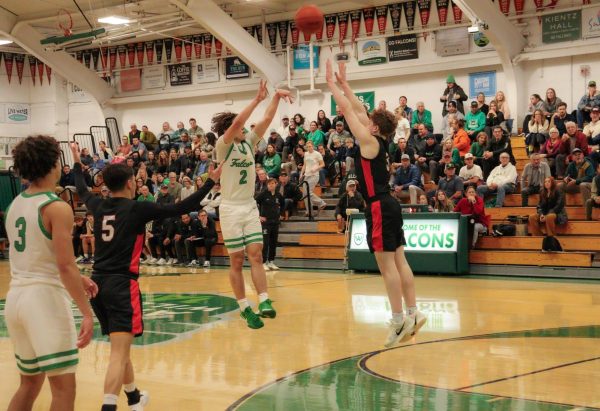 Junior Grady Stewart shoots a three-pointer over a San Rafael defender.