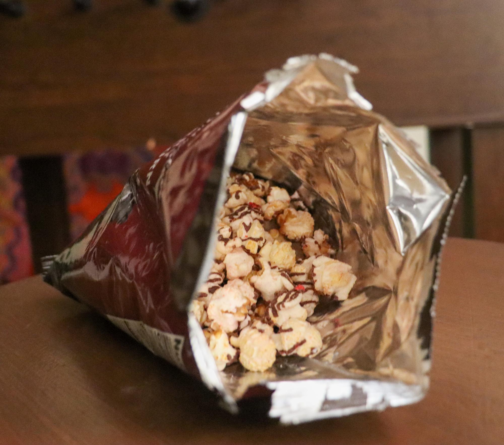 The Chocolatey Drizzled Strawberry Kettle Corn, our top pick for Trader Joe's Valentine's Day treats, combines kettle corn, milk chocolate, and freeze dried strawberries.