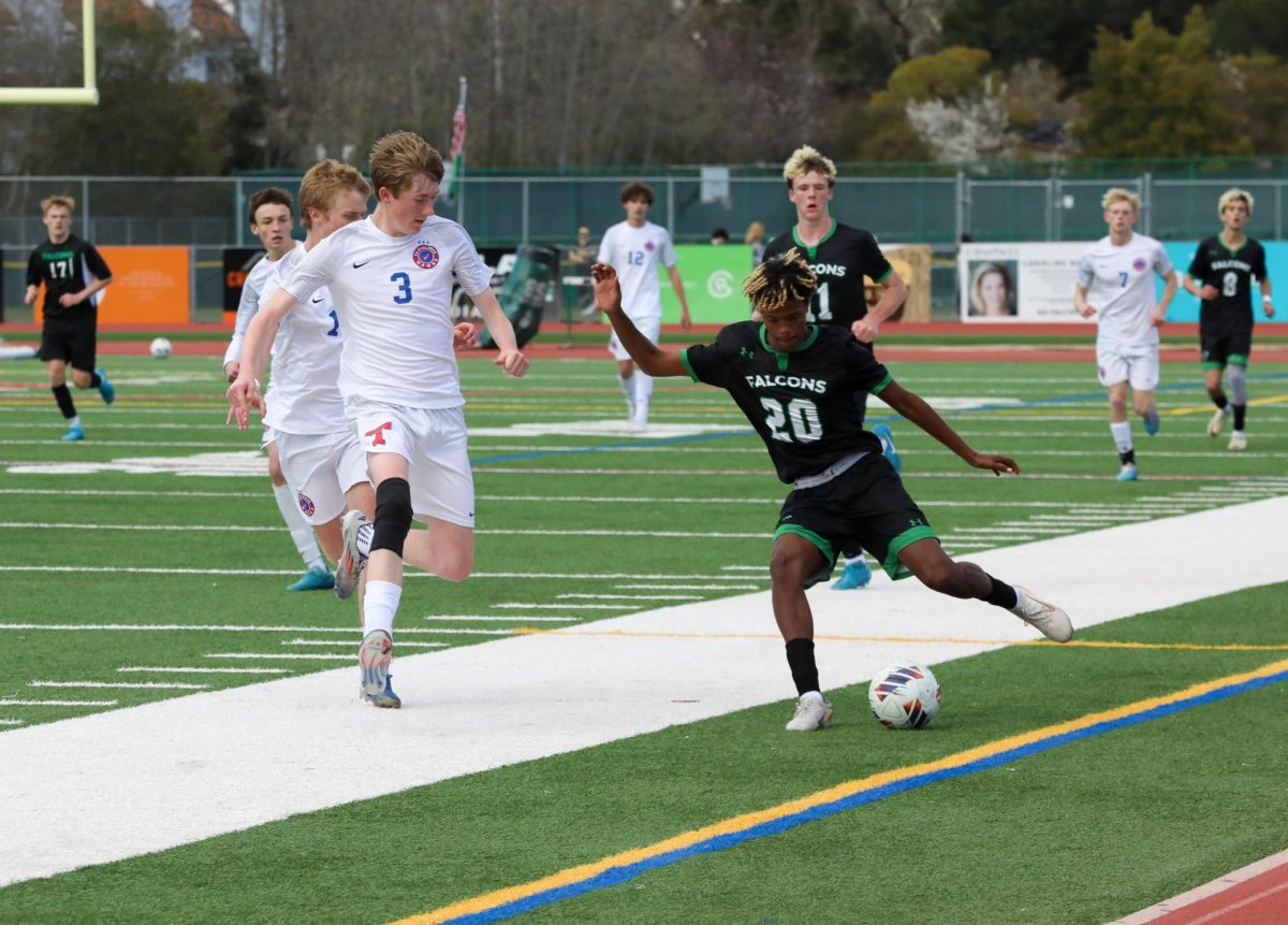 Senior Chala Rosenthal keeps the ball away from Tam players.
