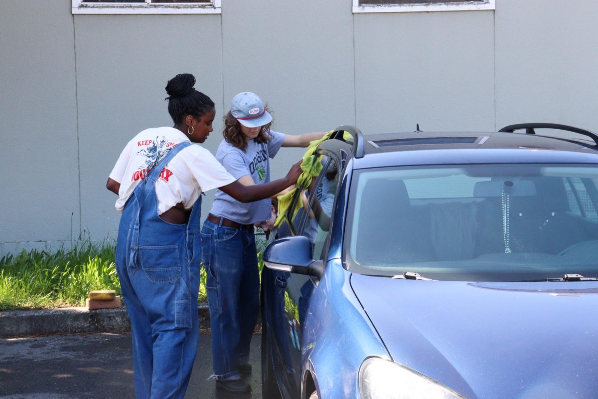 Team students wash a car at the Devonshire Parking lot.