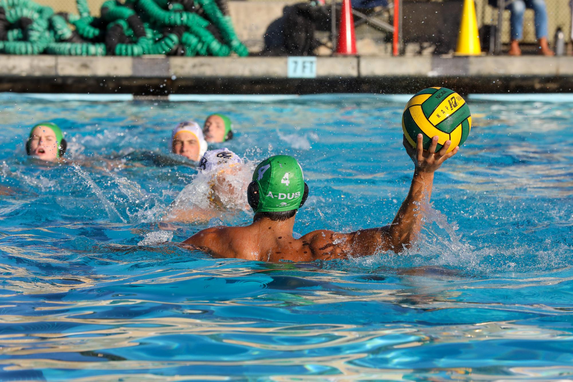 Archie Williams Junior Nate Greenberg looks to pass across the pool. 
