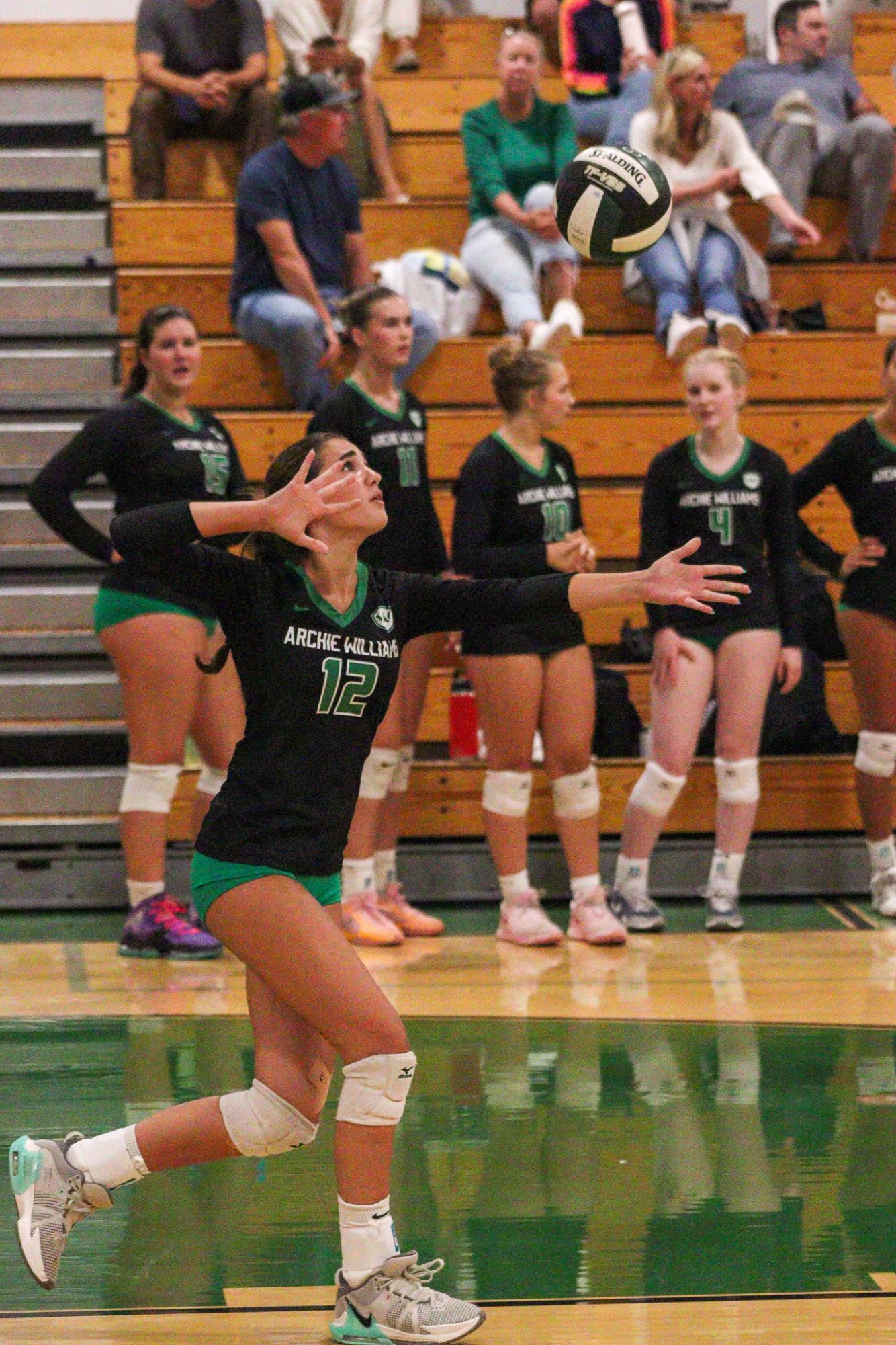Archie Williams sophomore Gianna Altman serves the ball in the second set.