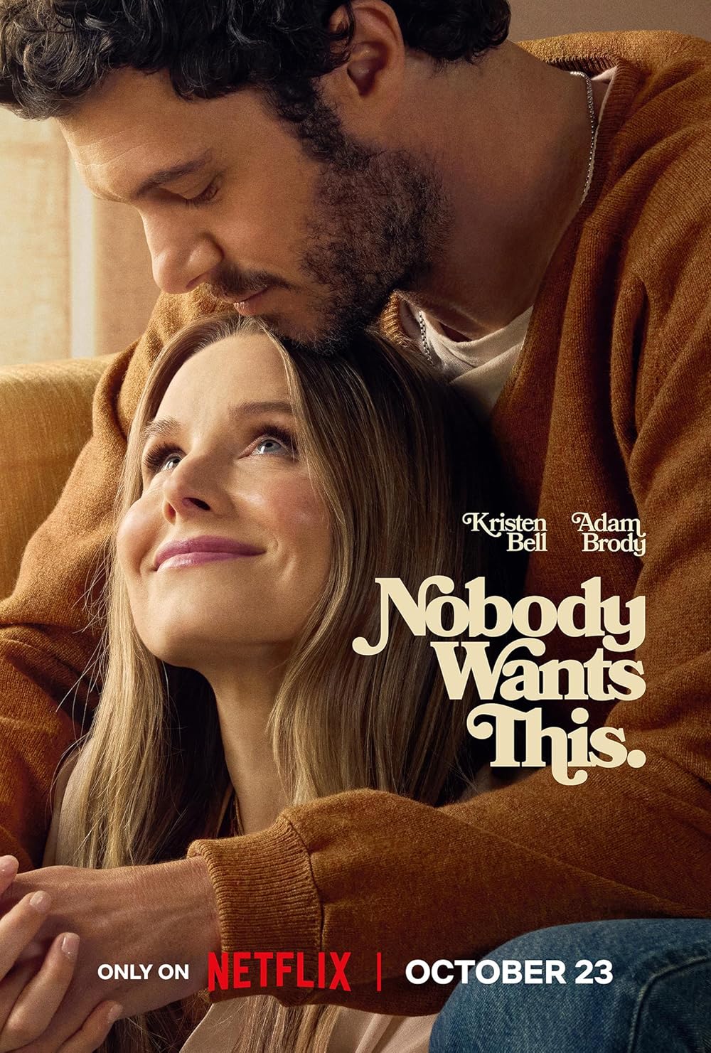 Joanne (Kristen Bell) looks lovingly up at Noah (Adam Brody) as they embrace. 
