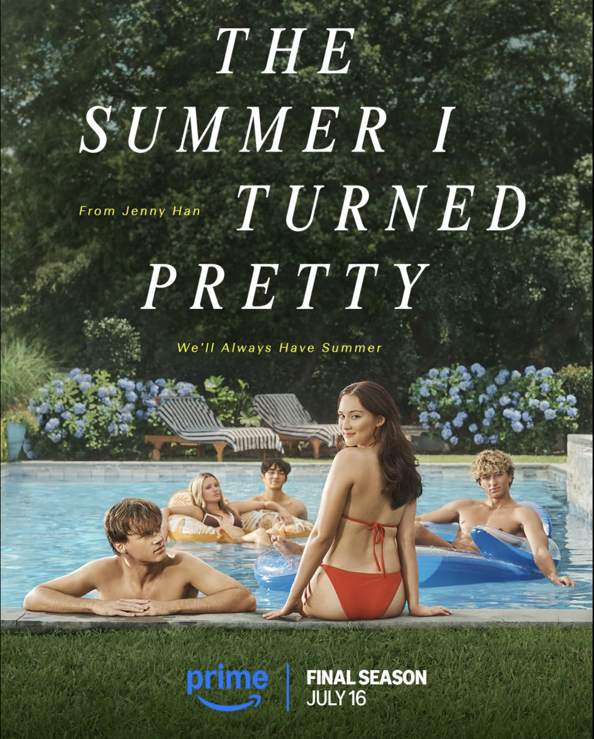 Sitting by the edge of the pool, main character Belly (Lola Tung) looks back at the camera. 
