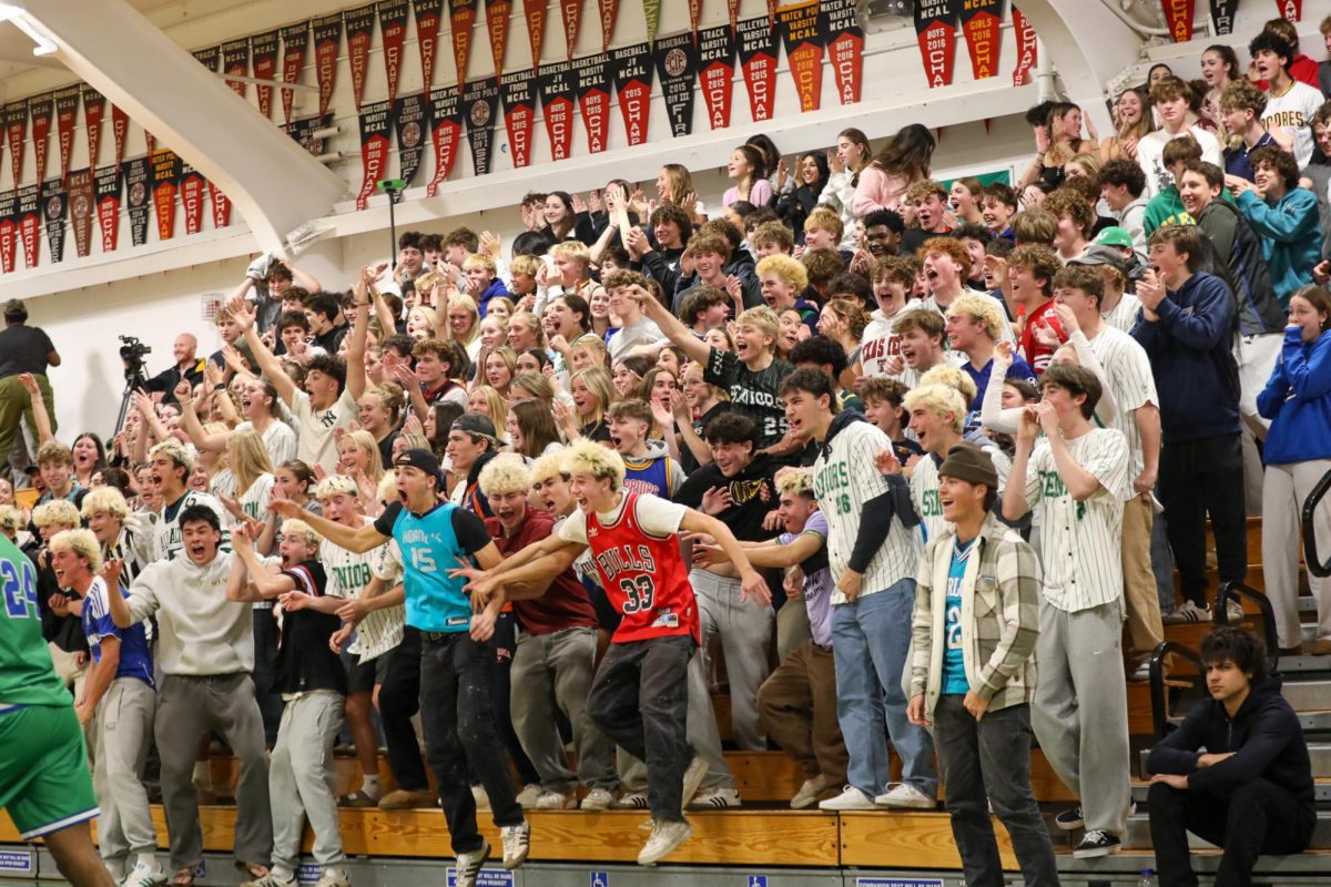 Archie Williams student section goes crazy after Senior Brian Wright dunks the ball. 

