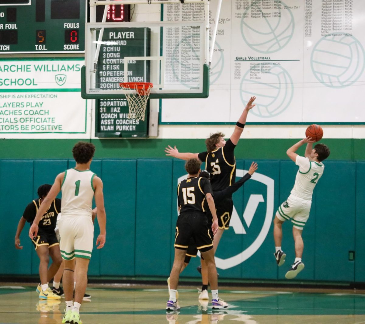 Senior Grady Stewart shoots over a Novato defender for a field goal attempt. 